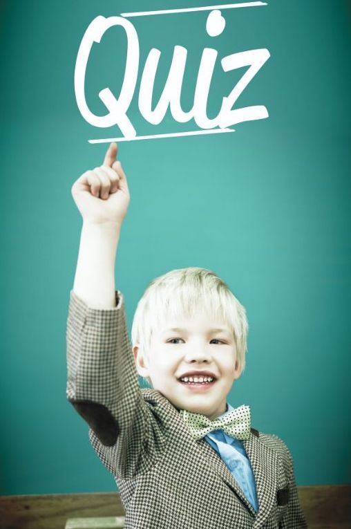 Boy pointing to word Quiz